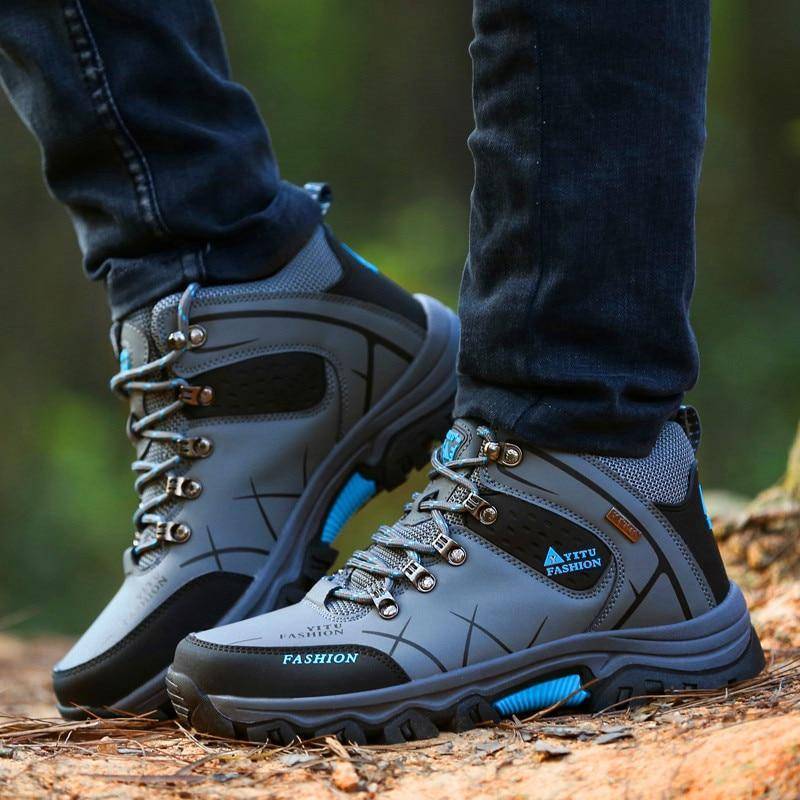 High top large hiking shoes among assorted outdoor, survival, camping, cycling, mountaineering, and hunting gears3
